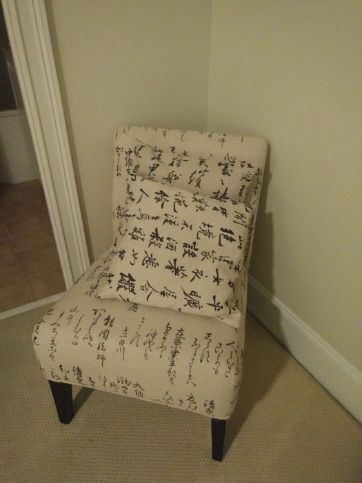 $70.00 Asian fabric accent chair , tan with black writing and wooden legs. 