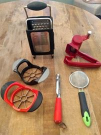 $14.00 Kitchen Lot #1  Apple slicers, apple corer, parm shredder, cheese grater, and sifter. 
