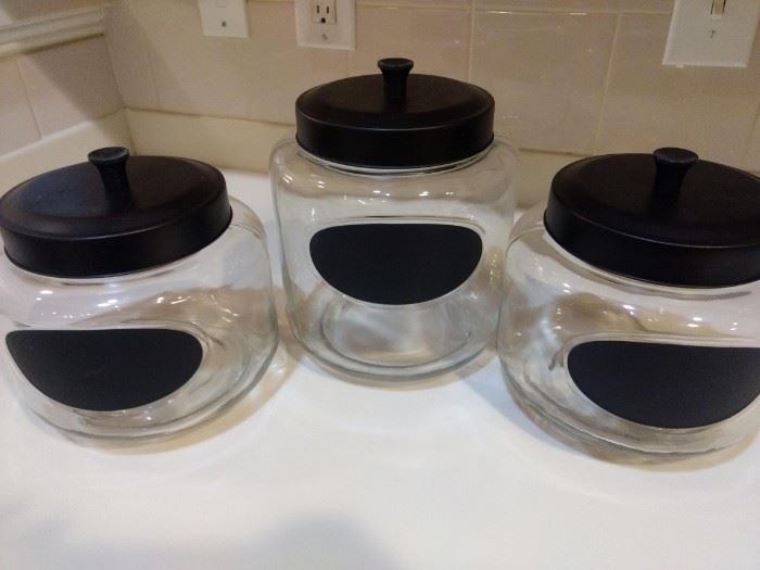 $20.00 Glass canister set. 3 Glass Canisters- 1 Large, 2 Medium with Chalkboard labels