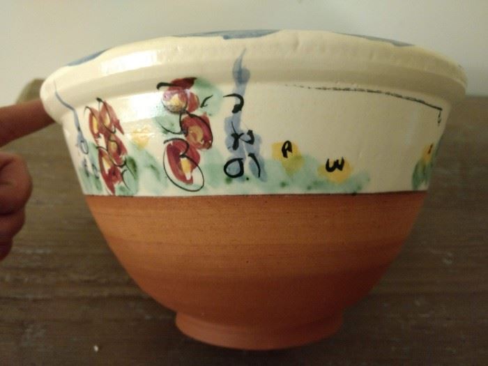 Small clay bowl with green and red flowers
