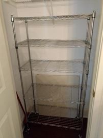 $25.00 Metal rolling rack with casters and shelves.  14x 30x 60"