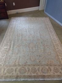$100.00  Light colored rug (No tag) 5'9"x8'10"