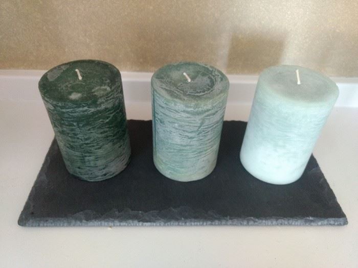 $12.00 set of three candles green and color never burned on slate plate