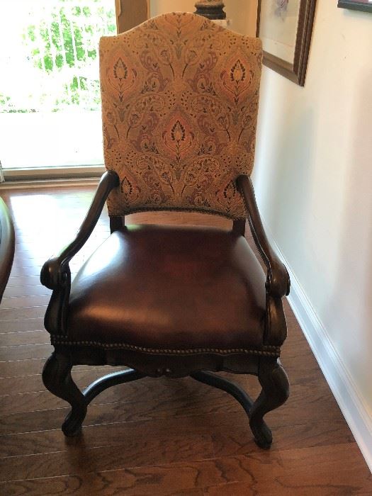 one of four dining room chairs:  quite large, leather and upholstery fabric