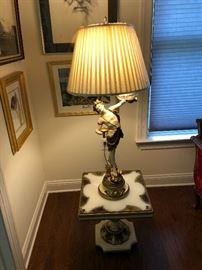 Graceful figural lamp on table