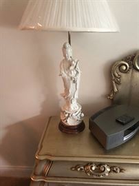 one of a pair of blanc de chine lamps on one of the bedside tables.  