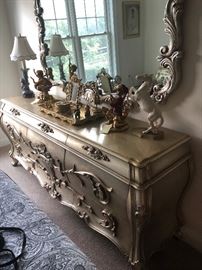 low dresser for the bedroom set, which is quite decorative.  all items on the dresser are for sale as well