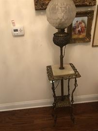 wonderful  patterned globe lamp attached to marble topped table.  Old
