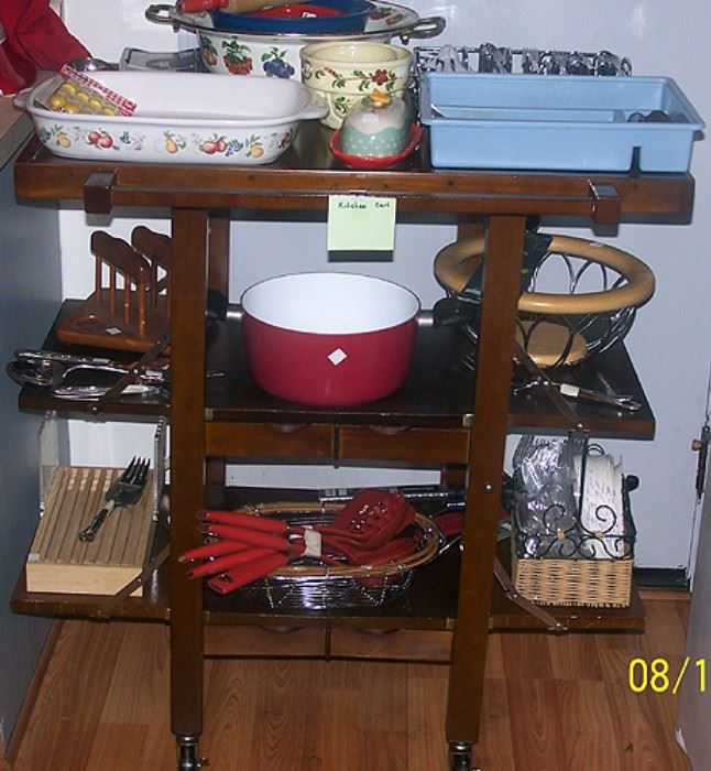 Oasis Island wood rolling kitchen cart with kitchen items