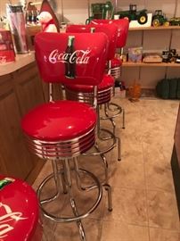set of 3 Coca Cola bar stools with backs in excellent condition.  One Coca Cola stool.