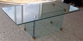 Glass top and base coffee table.