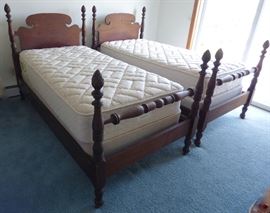Pair antique single-size poster beds.