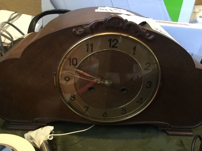 Very old mantel clock in working condition with key.