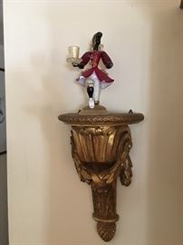 One of two Venetian gentlemen with a top hat on decorative shelf