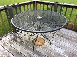 wrought iron table and two chairs