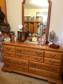 All wood bedroom set..... dresser and mirror from the Sumter Cabinet company.  Has two matching bedside tables and headboard/footboard that can be queen or full.  Currently  a full mattress set with it. 