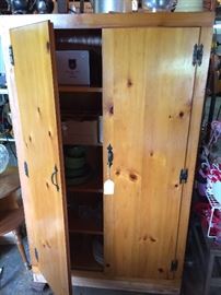 Nice storage cabinet with 4 interior shelves.