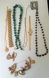 Fine jewelry including a lovely charm Bracelet