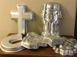 Large assortment of Wilton cake molds.