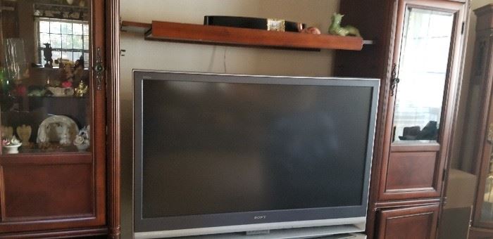 One of the flat screens and entertainment unit