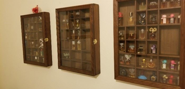 Shadow boxes and perfume bottle collection