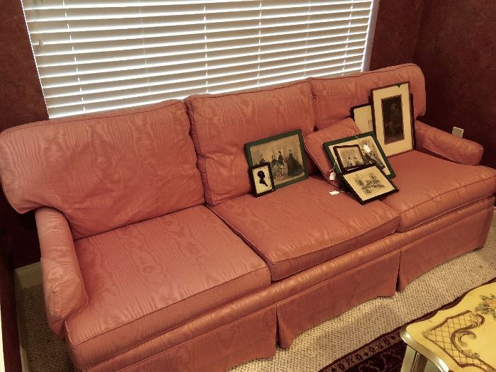 Moire fabric covered sofa in pale coral.