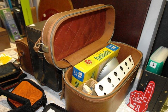 Several vintage camera cases