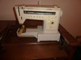 Singer machine in cabinet