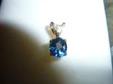14K yellow gold pendant. Tanzanite stone 8.5 x 7x 6.15mm - 3.35 carats. One trillion cut diamond 4 x4mm; Color j-k, Clarity SI1 w/appraisal