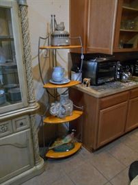 corner cabinet with pottery items