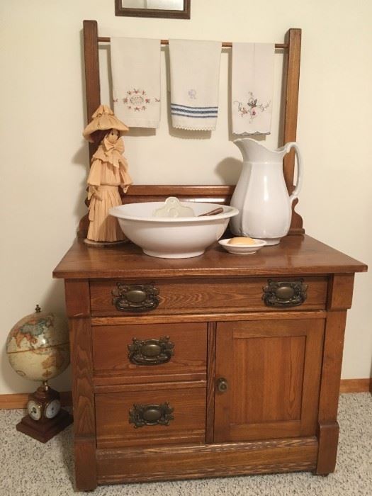 3 drawer antique wooden dresser (no mirror) in great condition.   Pitcher, bowl and soap dish, along with the globe and doll are also for sale