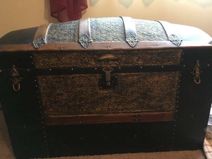 Beautiful metal chest, inside has been redone with red lining. in great condition