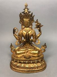 Lot 391 Gilt Metal Seated Deity. Cast lotus base. 
