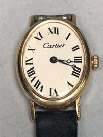 Lot 576 CARTIER 14K Gold Ladies Watch. Oval yellow gold c