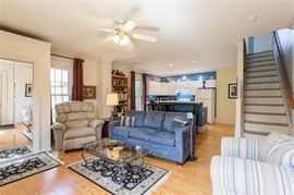 Living room couch, Leather recliner, Glass top coffee table with iron base and matching end tables .