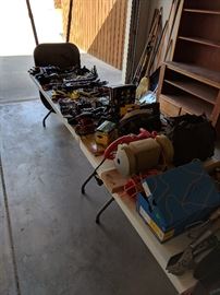 Hand tools, bench grinder, wheel barrow and more!  The cabinet in the background is also for sale