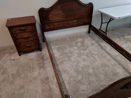 Antique double bed with headboard, footboard and rails.  No mattresses with this one.  Notice the matching nightstand?  There is also a matching dresser and chest of drawers.