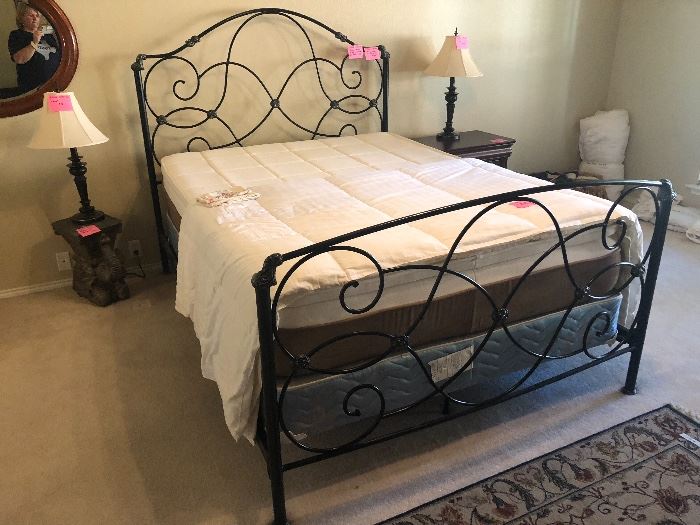 Black wrought iron Queen size bed with foam mattress
