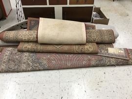 Various rugs in several sizes from an estate