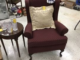 Red cloth wingback chair with curved legs