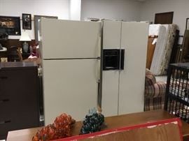 Top freezer refrigerator with ice maker and side by side refrigeratot