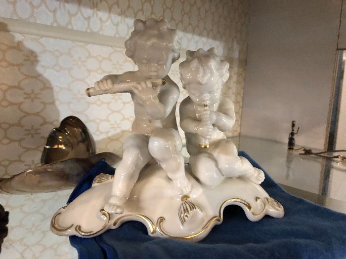  Hutschenreuther porcelain figurine of 2 cherubs playing music by Karl Tutter. It measures 6 1/4" tall and is in excellent condition with no chips, cracks, or repairs. 