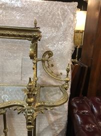 Elegant  brass étagère with decorative acanthus leave accents with curved Dolphin feet