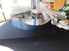 This MCM hanging chandelier is amazing. Note, it is upside down on the table, but has about 30 glass tubes what will hang from it.