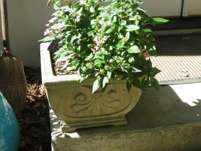 2 OF THESE CEMENT PLANTERS.