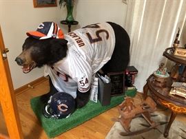One-of-a-kind! This is the ultimate Bears' fan sports item! This is the only one in
existence, as it was a raffle prize at a local charity. American full size black bear on all fours , with Brian Urlacher sign jersey number 54 ; a total
of eight Chicago Bears' signatures, including Dave Duerson .
Signed helmet, football & hat purchased separately.