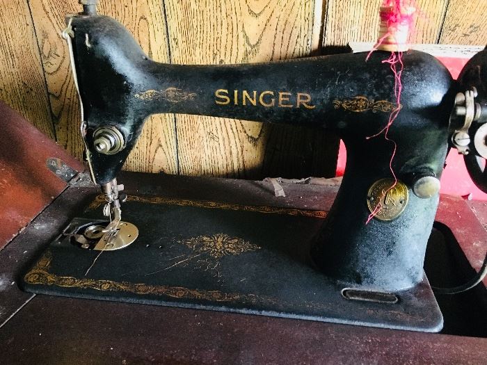 Vintage Singer sewing machine with metal decorative treadle base