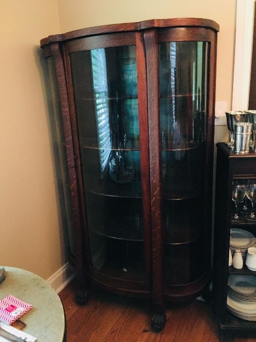 1890's oak clawfoot bow front china cabinet