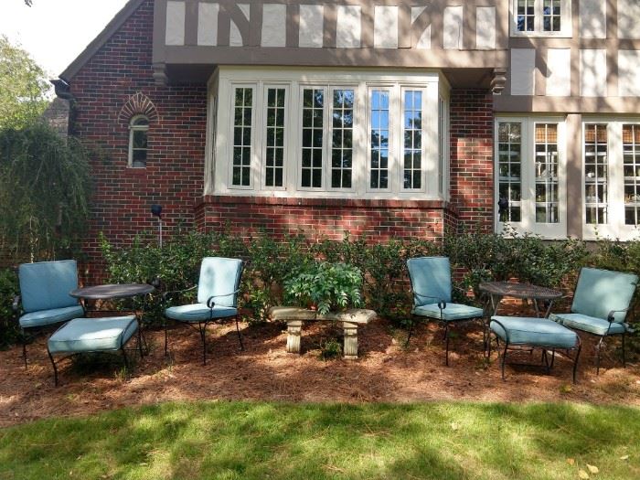 Dappled Fall sunlight, concrete bench, vintage wrought iron chairs, table and ottomans - bring the milkshakes!