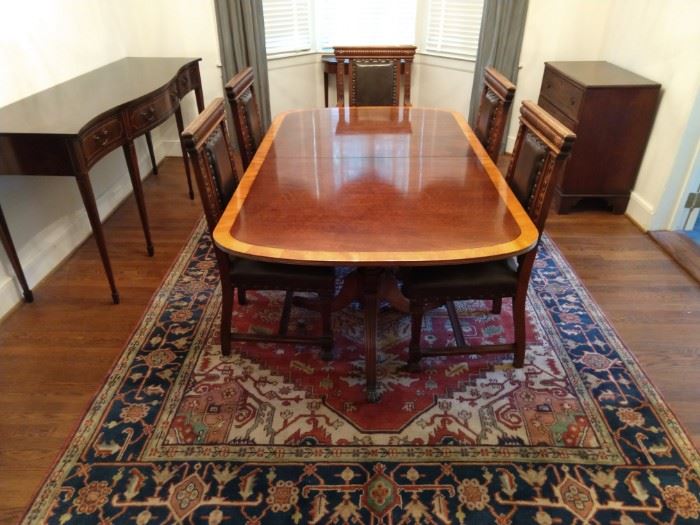 Wonderful Henredon "Ashton Court" banded mahogany dining room table, with two 2' leaves (center), Federal style serpentine mahogany sideboard (left), antique English mahogany three-drawer chest (far right).